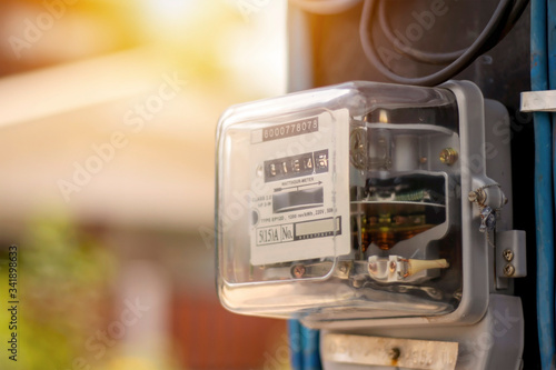 Obraz na plátně Electricity meters for home electrical appliances, including blurred natural gre