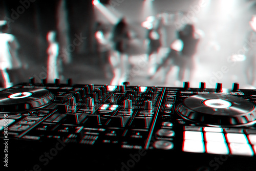 professional DJ mixer controller at a concert in a nightclub