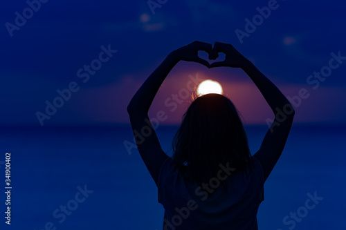 Woman with arms wide open enjoying ocean tropical time.