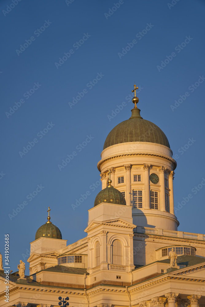 Closeup of top of Helsinki Cathedral in Finland with blue sky background