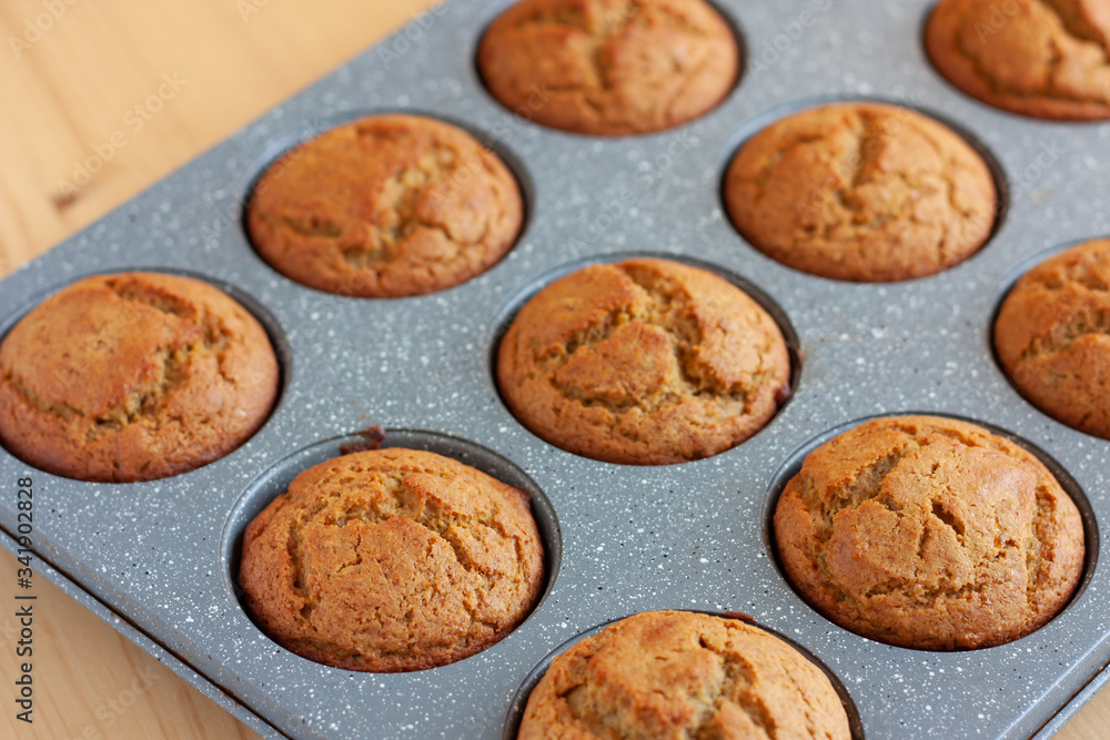 Carrot muffins in metal baking form. Homemade tasty dessert or breakfast. Healthy eating concept.  Selective focus