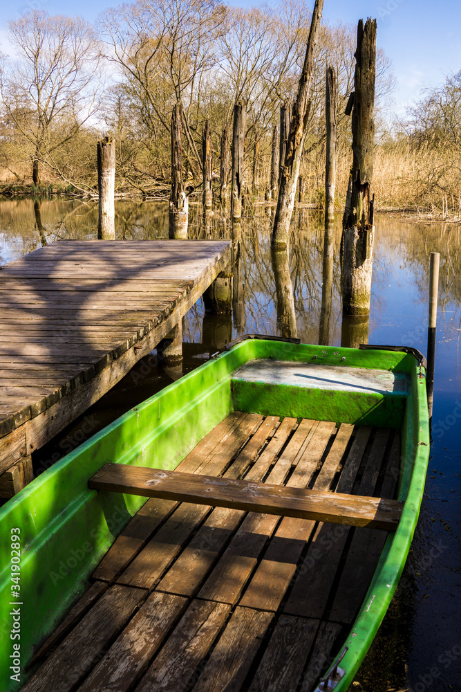 row boat towed to lake shore fishing