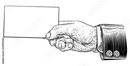 A hand in a suit holding a business card, letter, message, flyer or similar with copyspace. In a vintage engraved or etched woodcut print style
