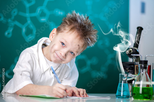 Boy in chemistry lesson