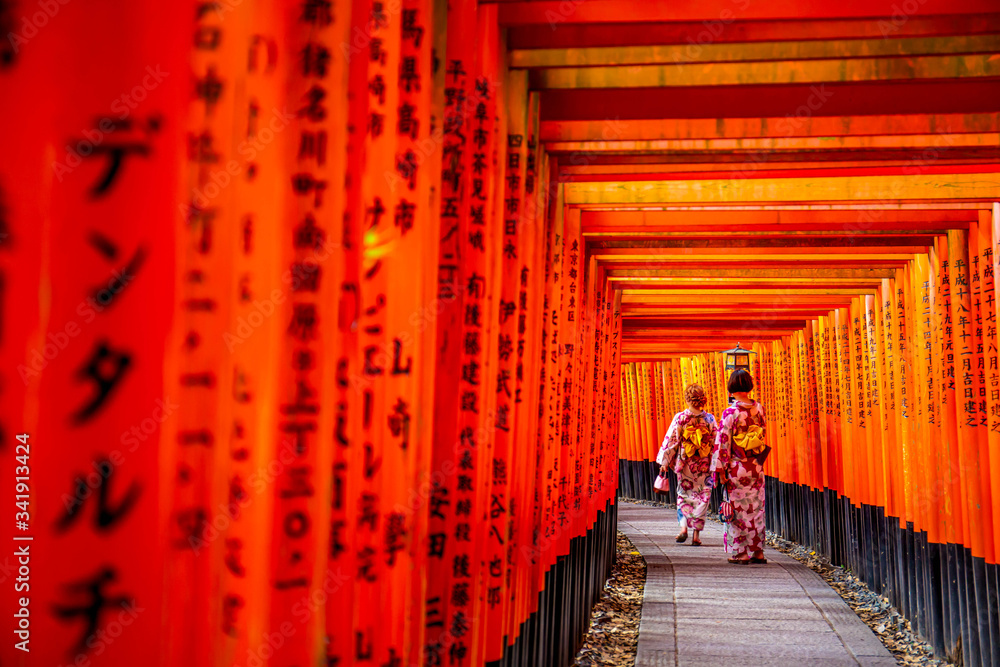 Fototapeta premium Red wooden torii Gate at Fushimi Inari Shrine in Kyoto, Japan. One of the popular site in Kyoto.