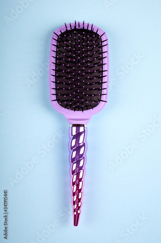 Hair comb on color background.