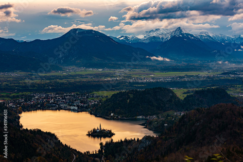 the church on bled lake at sunset