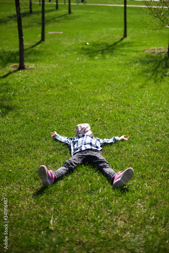 little girl running on the grass