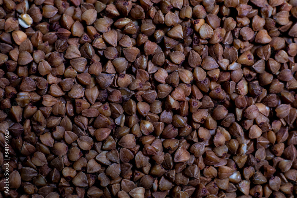 Close-up buckwheat background. Food product porridge buckwheat Close-up buckwheat background. Food product porridge buckwheat