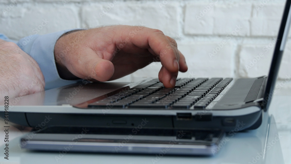 Businessman Using a Laptop and Working Online from Home, Man Accessing an Online Connection with Company Office Businessman Using a Laptop and Working Online from Home, Man Accessing an Online Connection with Company Office