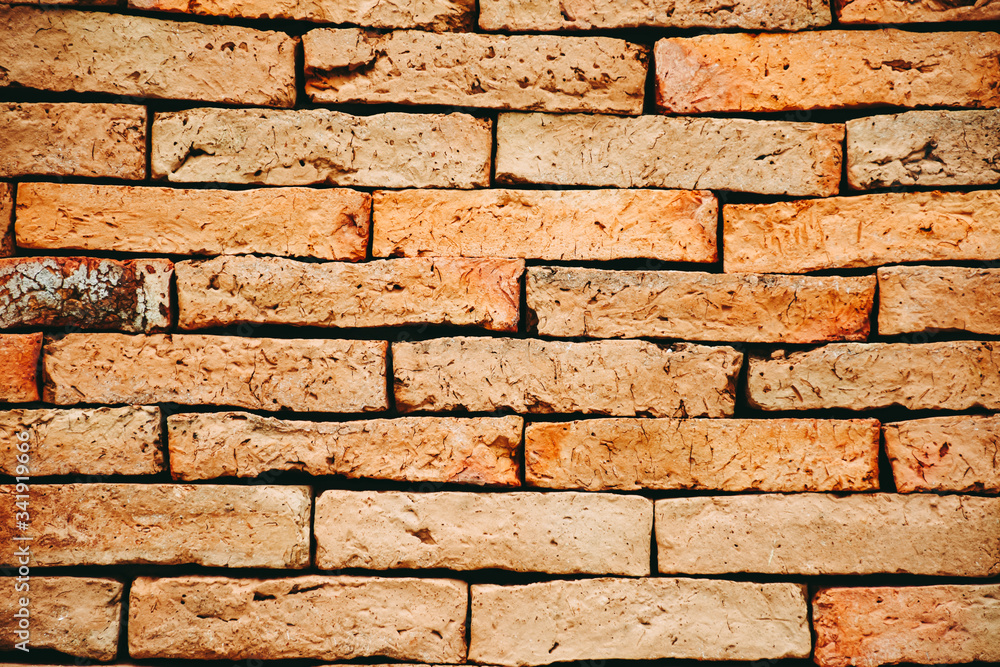 Fototapeta premium Background of rough brick wall texture. Rough old brick texture, surface.
