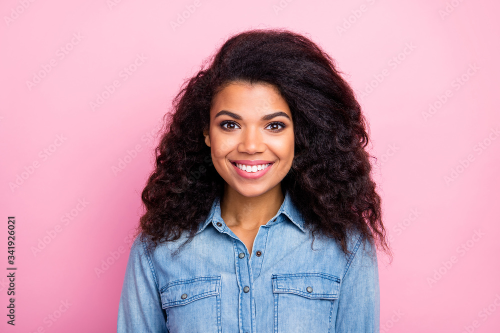 Fototapeta premium Portrait of charming cute girlish afro american gir look good in camera wear casual style clothing isolated over pink color background