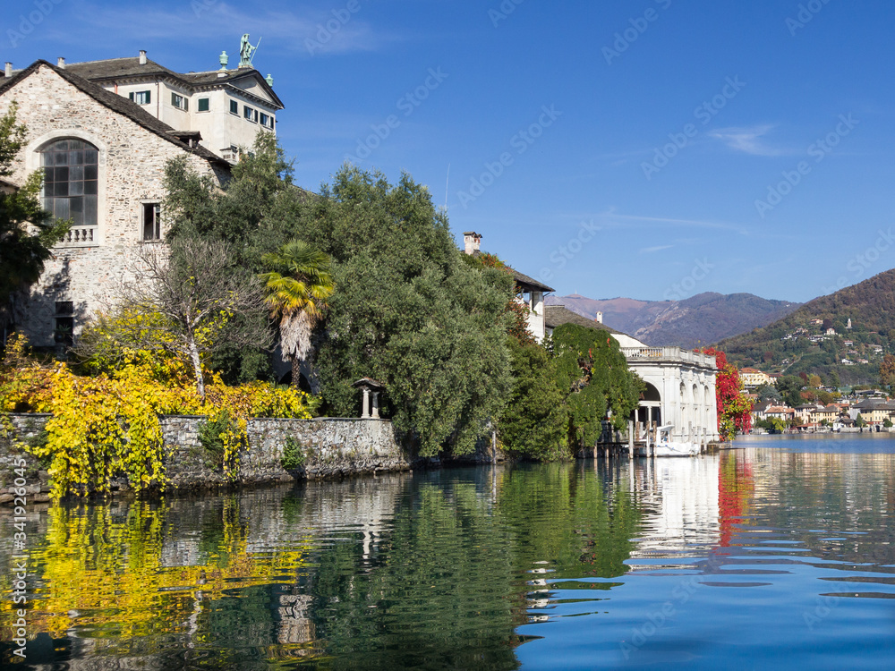 old buildong reflection on a lake in europe with autumn colors old buildong reflection on a lake in europe with autumn colors