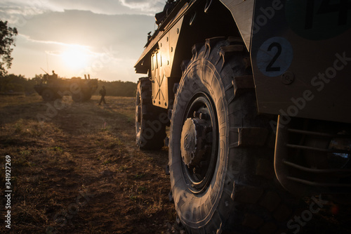 vehicles stoped with a sunset in the background during the preparation in the Canjuers camp of French soldiers leaving for four months of Opex in Mali  photo