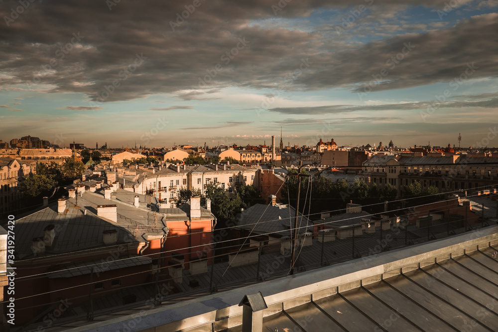 Amazing sunset on the roofs of the old district of St. Petersburg