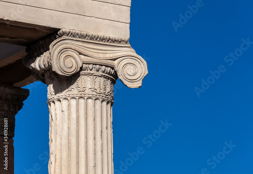 Marble antique column with a cap of ionic order.