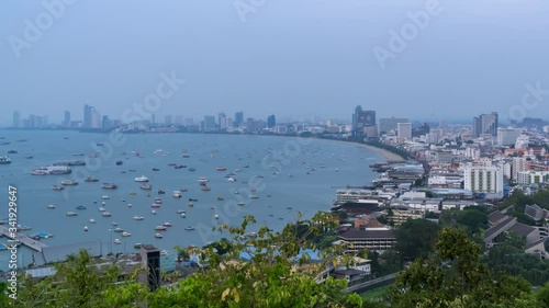 Pattaya bay and Bali Hai Pier, from Phra Tamnak Mountain viewpoint, day to night, Chonburi, Thailand - Time Lapse photo