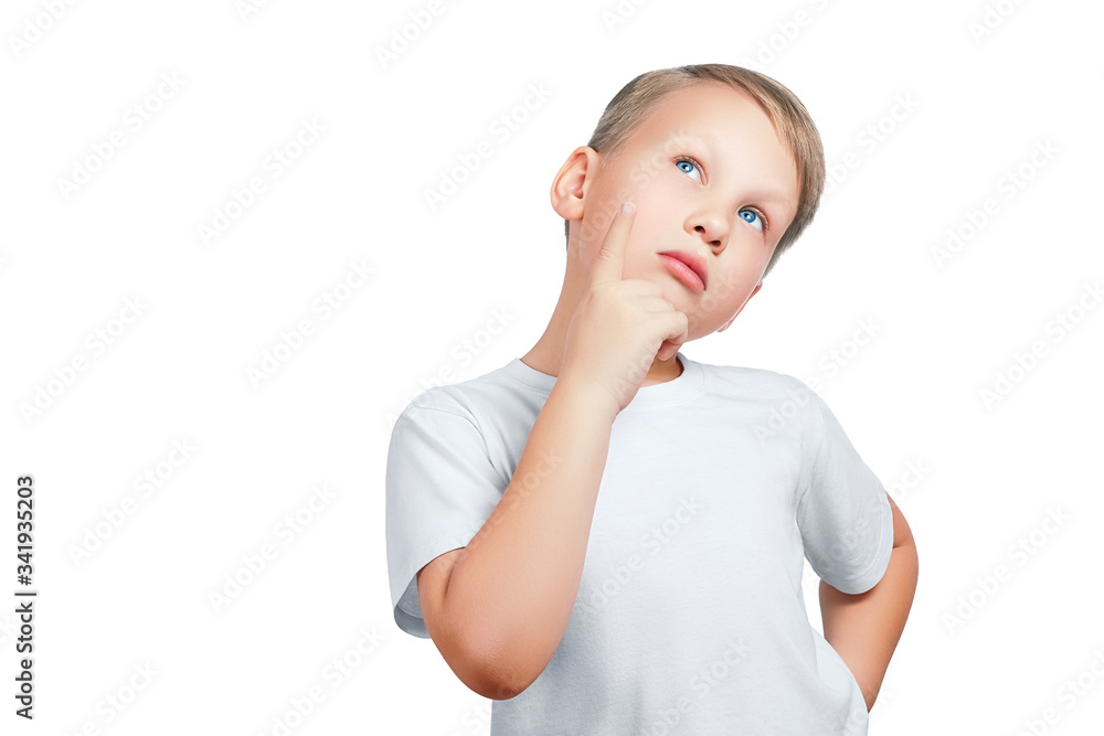 Attractive eight year old thinking or dreaming boy in a white t-shirt isolated on white background Attractive eight year old thinking or dreaming boy in a white t-shirt isolated on white background