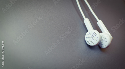 horizontal closeup of headphones on metal gray background