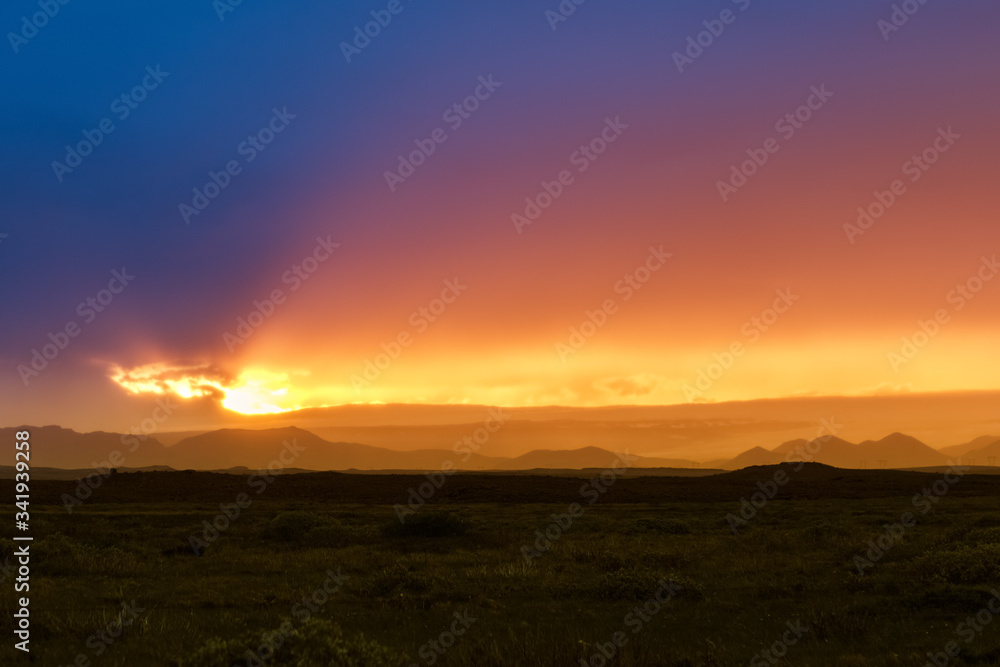 Epic sunset scene of dramatic sky in Iceland. Beauty of nature background landscape in dark tones.