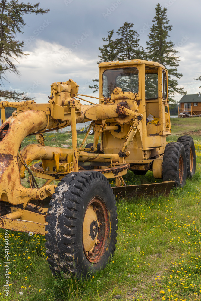 yellow tractor in the middle of the field yellow tractor in the middle of the field