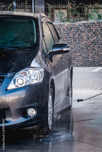 Self-service car in a car bubble wash.