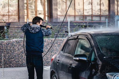 Self-service car in a car bubble wash. © corkmaxim