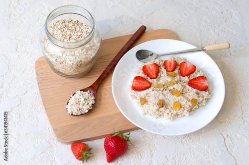 Oatmeal with strawberries for breakfast, carbohydrate healthy breakfast photo