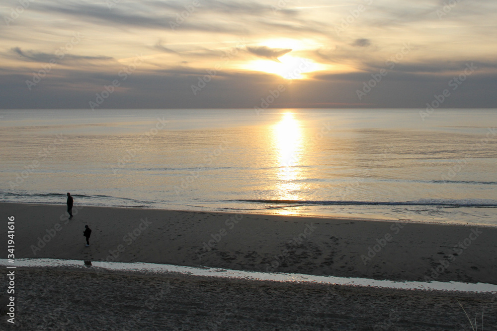 Atlantic ocean sunset on sandy tourist beach in Lacanau France