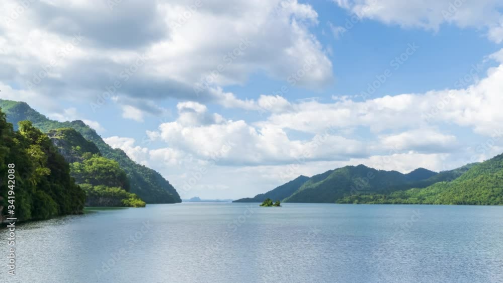 Beautiful lake reservoir and mountain in Kanchanaburi with dramatic cloud movement, Thailand - Time Lapse Beautiful lake reservoir and mountain in Kanchanaburi with dramatic cloud movement, Thailand - Time Lapse