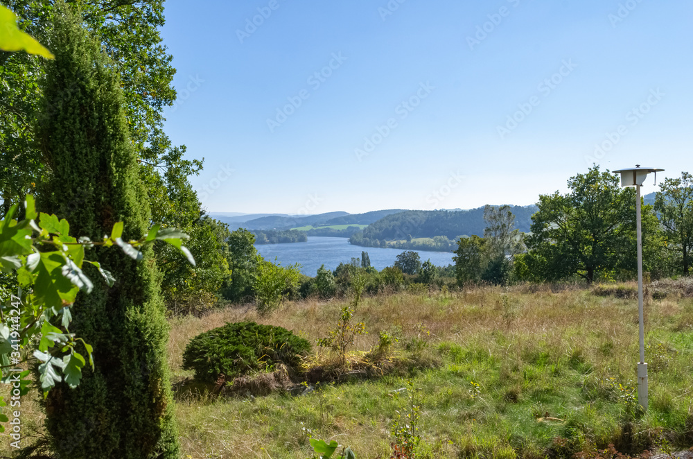 view of a lake in summer in nature view of a lake in summer in nature