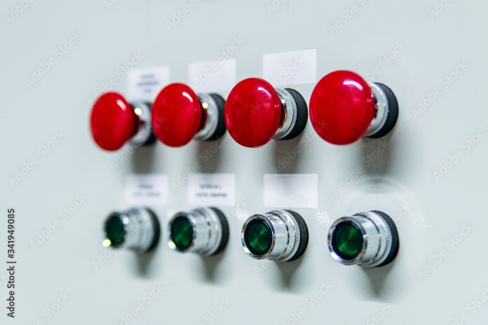 Control panel with red and black buttons. Equipment start and shutdown buttons.