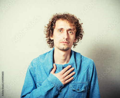 Young man suffering pain on his chest