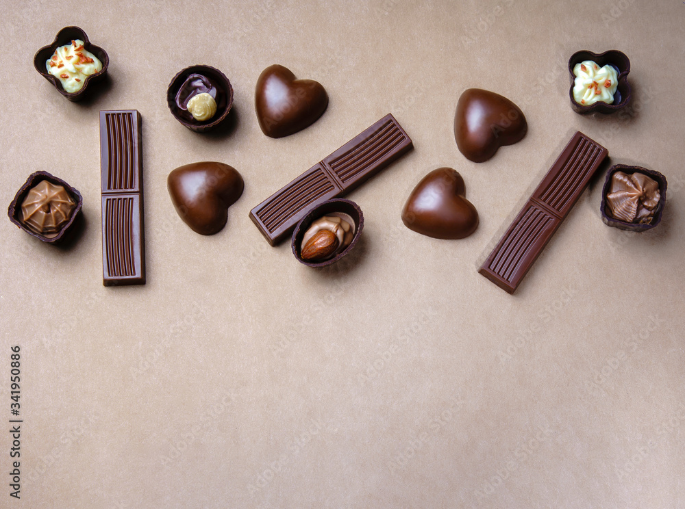 chocolate of different shapes on a paper background