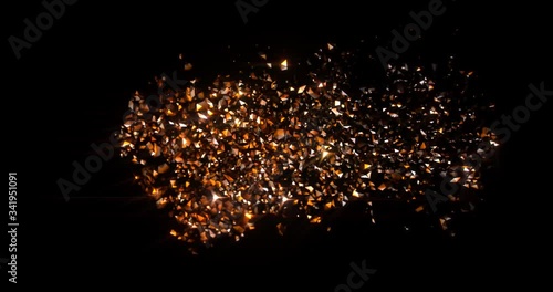Abstract Gold Particles Background with sparks and glowing elements shining bright particle stars on black background