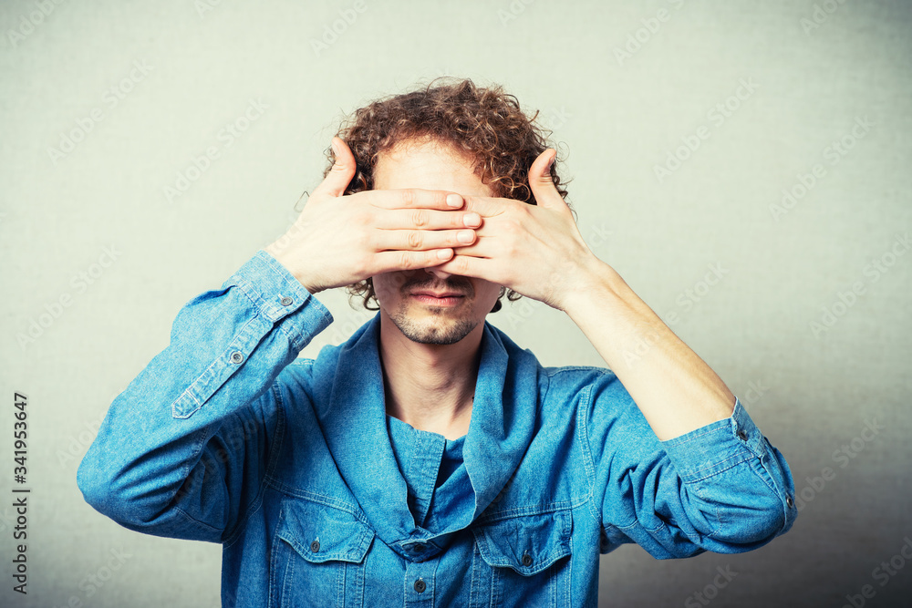 man closes his eyes with his hands man closes his eyes with his hands