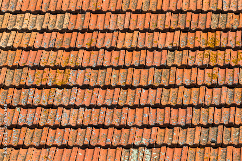 Texture of orange clay roof tiles. Red old dirty roof. Old roof tiles. Construction equipment build a house. Texture of orange clay roof tiles. Red old dirty roof. Old roof tiles. Construction equipment build a house.
