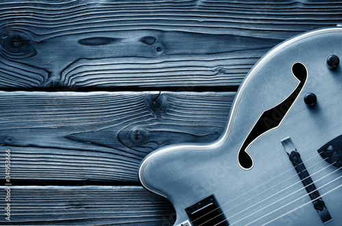 jazz guitar on aged wood blue background