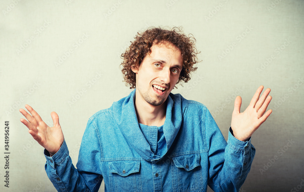 portrait of a young man with hands up portrait of a young man with hands up