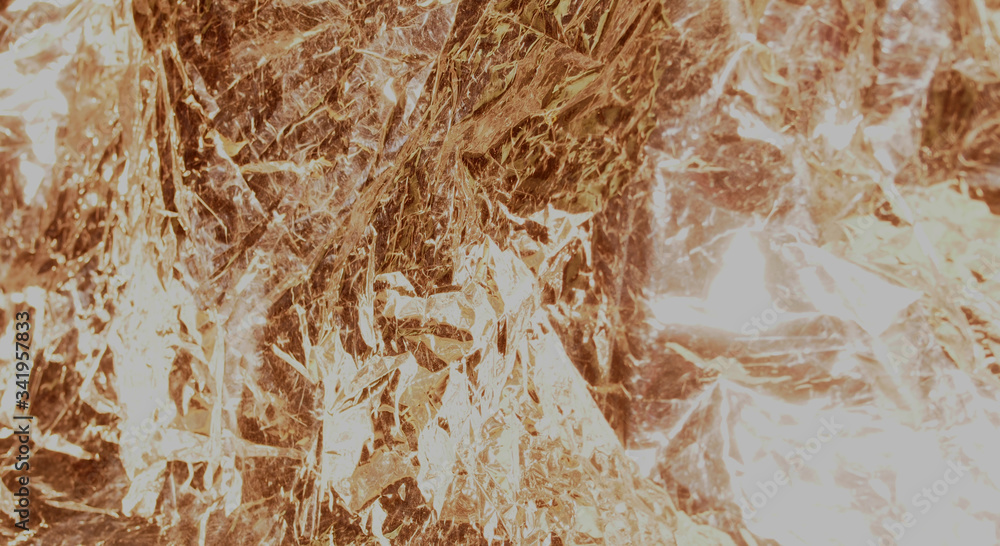 Golden shiny metallic texture. The background photo. Golden shiny metallic texture. The background photo.