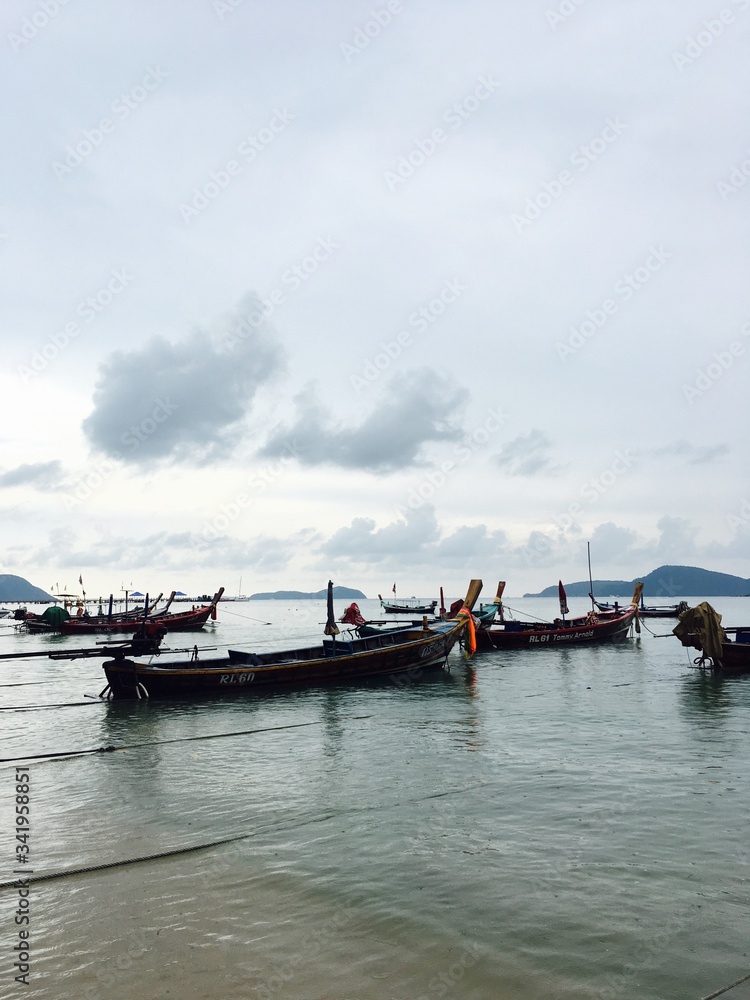 boats stand on the seafront in phuket