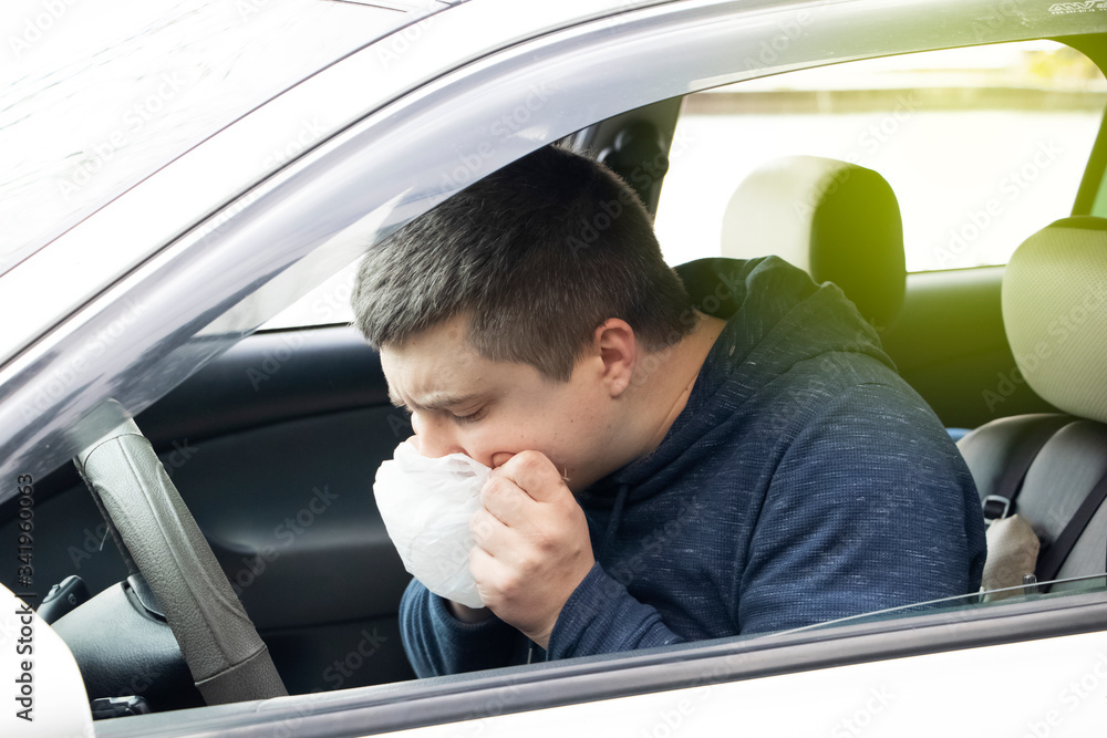A ride during a car trip. The driver suffers from kinetosis, motion sickness. The concept of motion sickness in transport and vestibular apparatus disease A ride during a car trip. The driver suffers from kinetosis, motion sickness. The concept of motion sickness in transport and vestibular apparatus disease