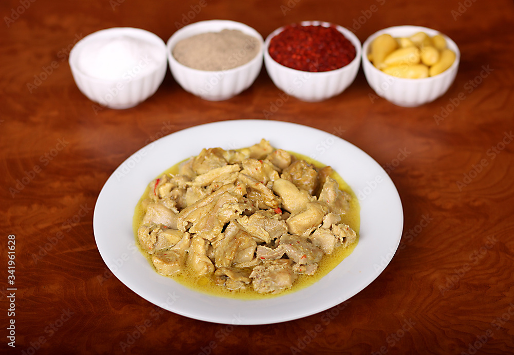 chicken with curry sauce and Turkish spices on plate chicken with curry sauce and Turkish spices on plate