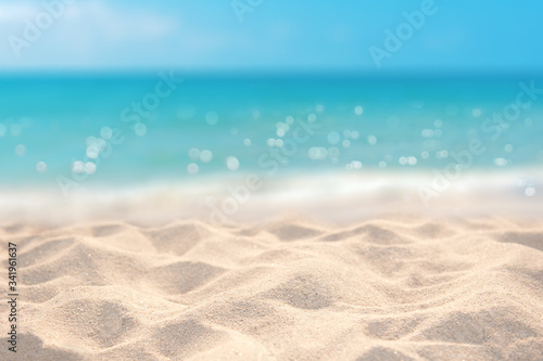 Fototapeta Sand with blurred tropical sandy beach bokeh background, Summer vacation and pro