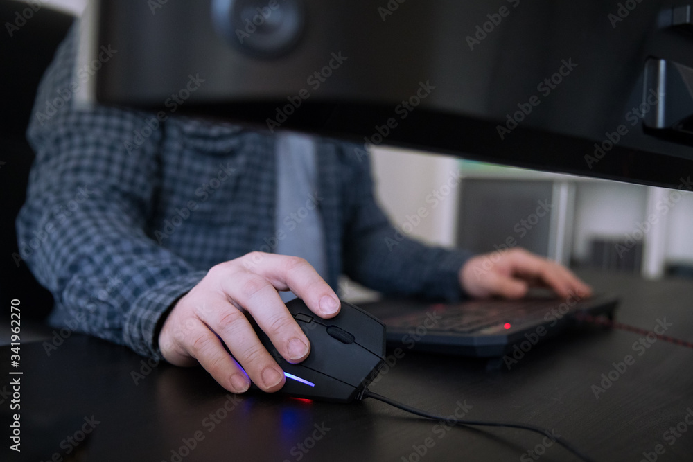 Man working on a computer, detail of hand on vertical mouse. Man working on a computer, detail of hand on vertical mouse.
