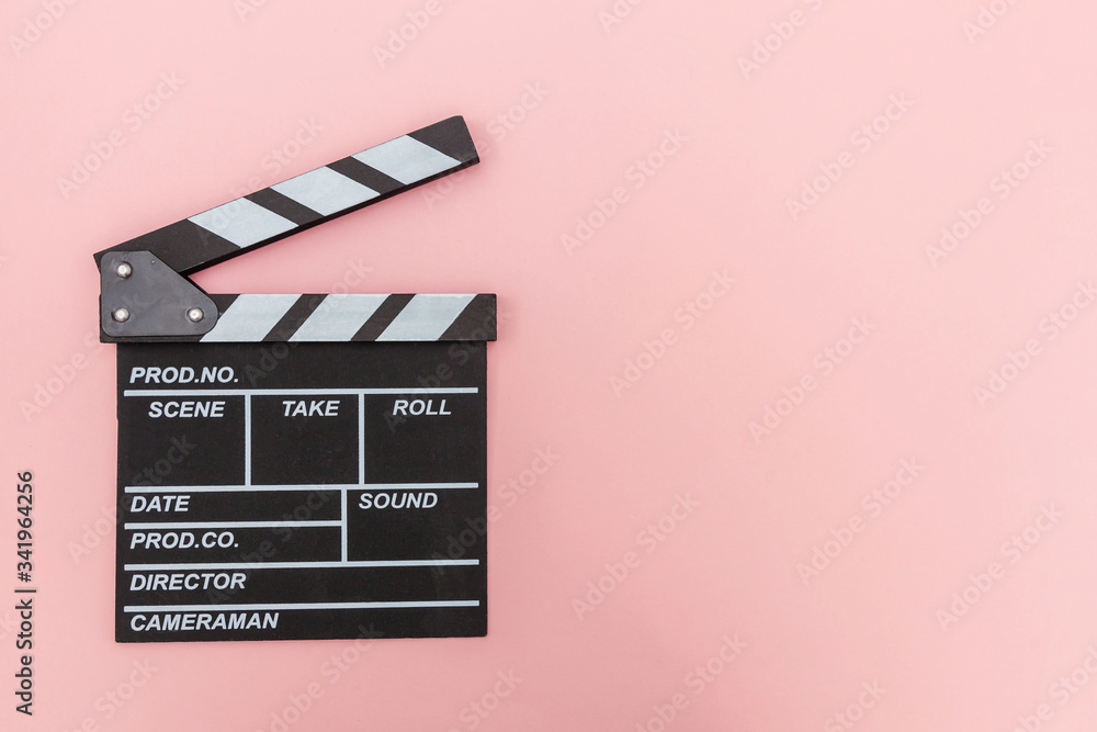 Filmmaker profession. Classic director empty film making clapperboard or movie slate isolated on pink background. Video production film cinema industry concept. Flat lay top view copy space mock up.