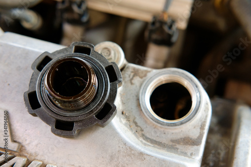 open oil cap of car engine for maintenance service