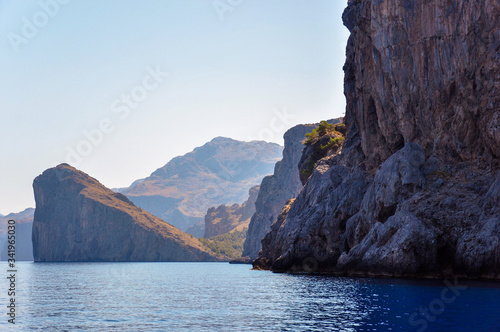 Mallorca coastline with large sheer cliffs against a blue sky