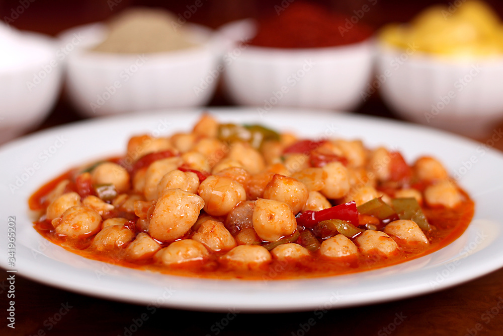 perfect turkish food chickpeas spicy on white plate close up on wooden table perfect turkish food chickpeas spicy on white plate close up on wooden table
