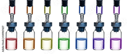 row of glass bottle of drug with syringe head in multi color isolated on white background